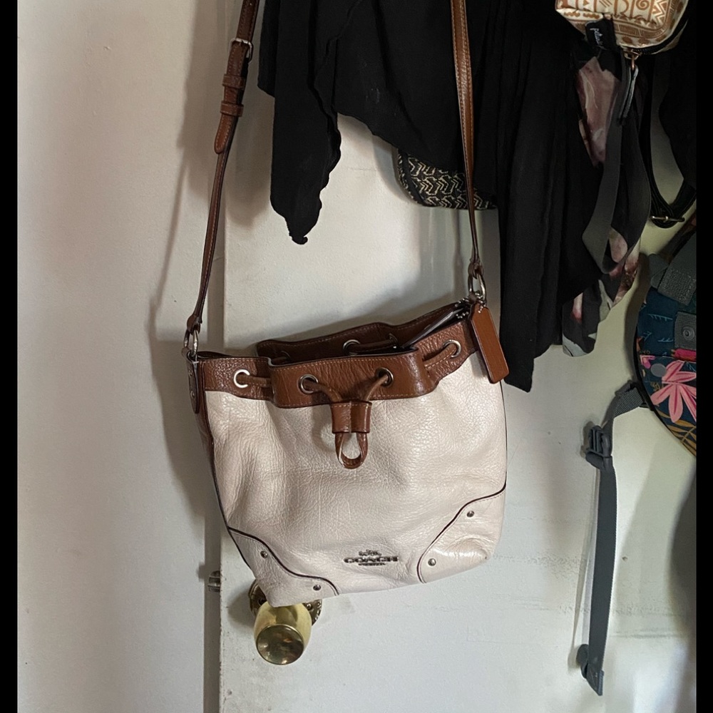 White and brown Coach crossbody purse